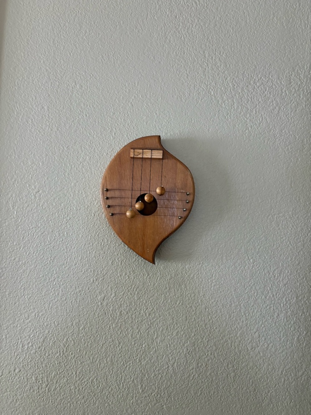 Wooden Leaf-Shaped Wall Decor with Harp Motif - Brown